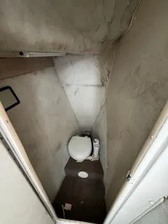 Slide: The Image of 2004 Baha Cruisers 290 King Kat boat interior bathroom with toilet. - 25