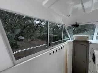 Slide: The Image of Interior view of 2004 Baha Cruisers 290 King Kat boat with large windows. - 28