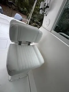 Slide: The Image of 2004 Baha Cruisers 290 King Kat boat seat, white upholstery, outdoor setting. - 33