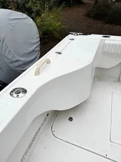 Slide: The Image of 2004 Baha Cruisers 290 King Kat boat deck with white seating and cup holder. - 35