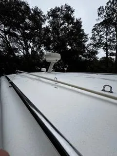 Slide: The Image of 2004 Baha Cruisers 290 King Kat boat deck with trees in the background. - 39