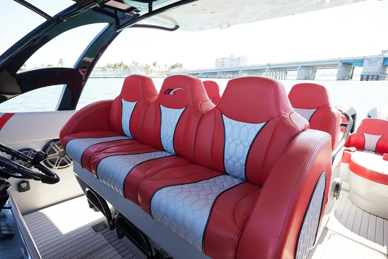 Slide: The Image of Luxurious red and white seating on a 2017 Midnight Express 43' Open boat. - 11