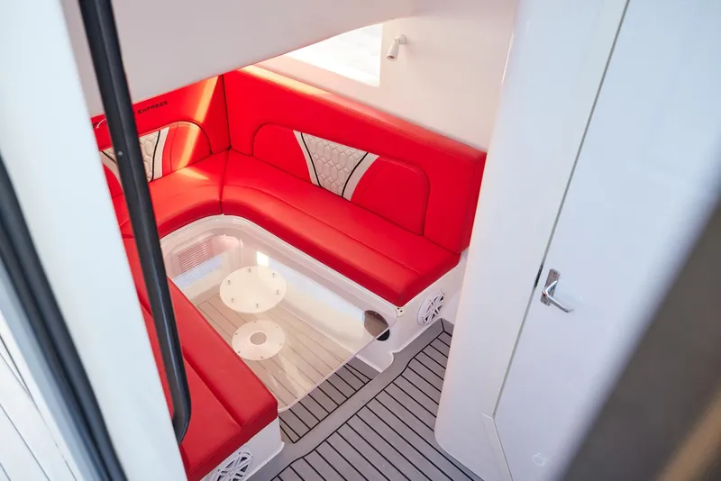 Slide: The Image of Interior of 2017 Midnight Express 43' Open boat with red seating and modern design. - 17