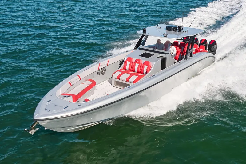 Slide: The Image of 2017 Midnight Express 43' Open boat cruising on water with red and white seating. - 2