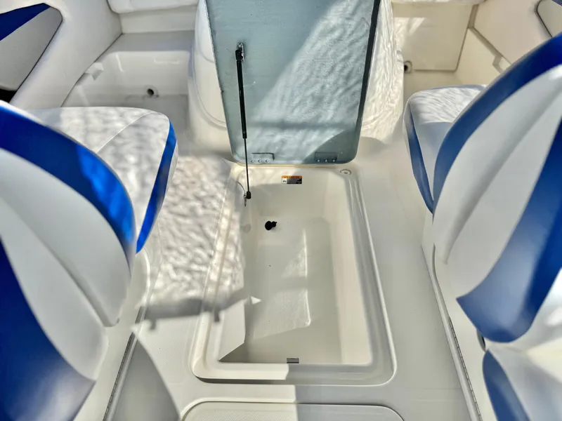Slide: The Image of Interior of 2007 Bayliner 192 Cuddy Discovery boat with blue and white seating. - 18