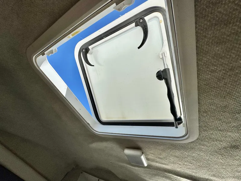 Slide: The Image of Open hatch on 2007 Bayliner 192 Cuddy Discovery boat, interior view. - 26