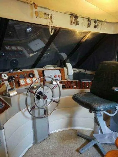 Slide: The Image of Pilot house interior of 2000 Bayliner 4788 Motoryacht with steering wheel and control panel. - 5