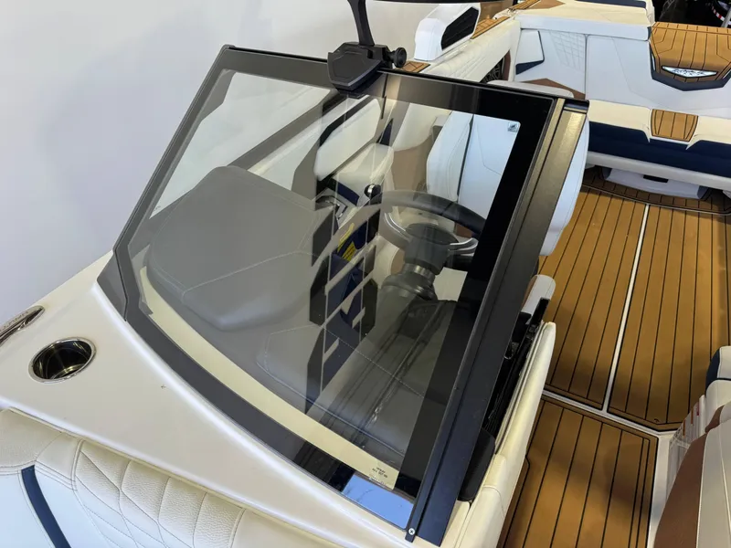 Slide: The Image of 2025 Nautique Super Air Nautique S23 interior with sleek design and modern dashboard. - 19