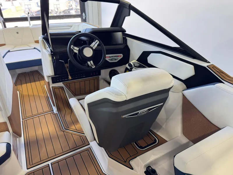 Slide: The Image of 2025 Nautique Super Air Nautique S23 interior with sleek design and modern dashboard. - 23