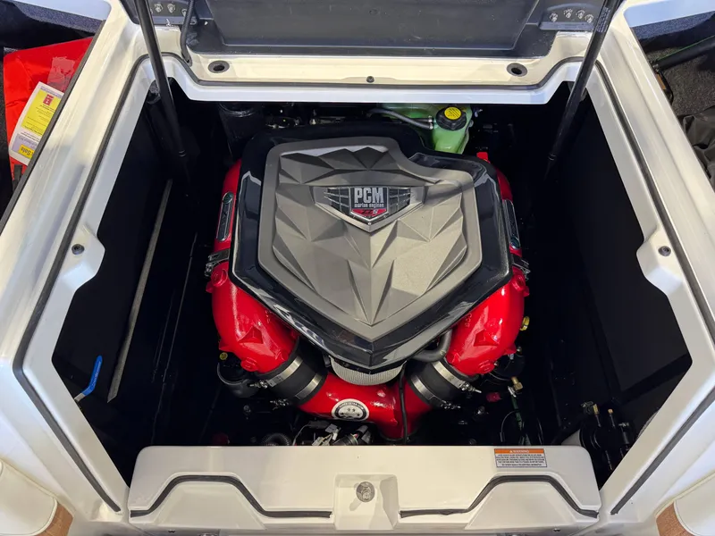 Slide: The Image of 2025 Nautique Super Air Nautique S23 engine compartment with PCM engine visible. - 27