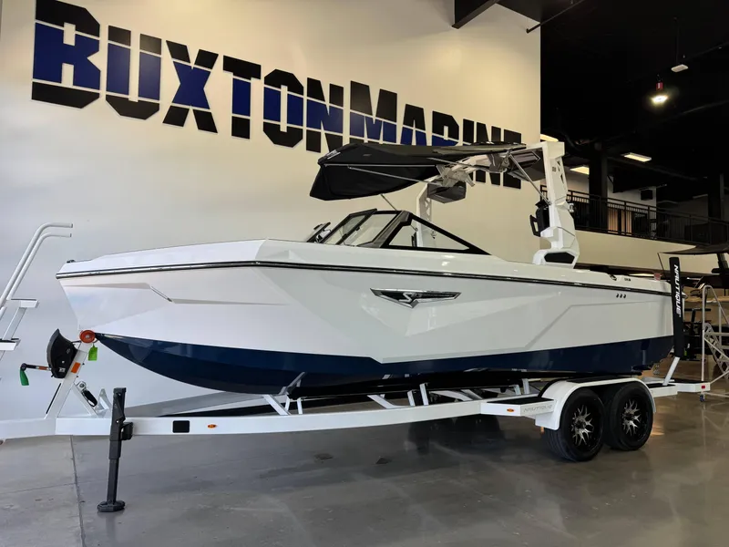 Slide: The Image of 2025 Nautique Super Air Nautique S23 boat on trailer at Buxton Marine showroom. - 3