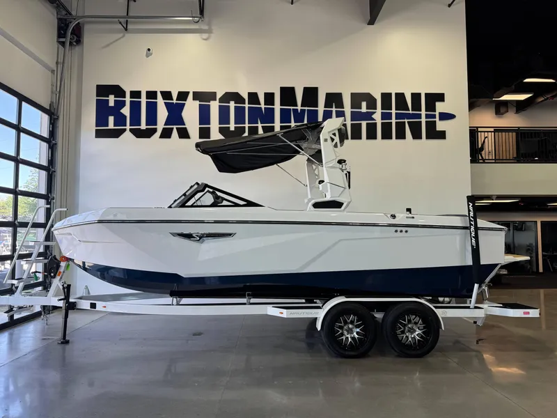 Slide: The Image of 2025 Nautique Super Air Nautique S23 boat displayed at Buxton Marine showroom. - 4