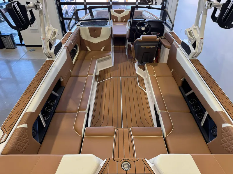 Slide: The Image of 2025 Nautique Super Air Nautique GS24 interior with luxurious seating and modern design. - 13