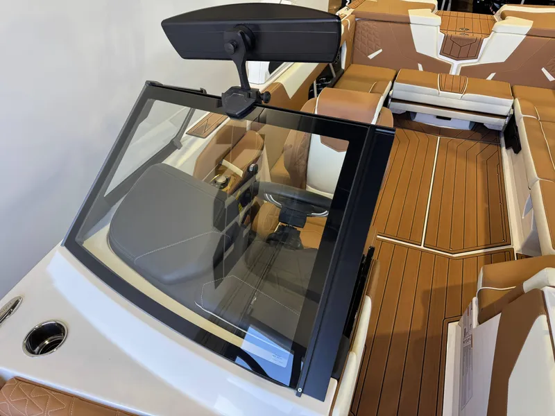 Slide: The Image of 2025 Nautique Super Air Nautique GS24 interior with tan seating and sleek design. - 20