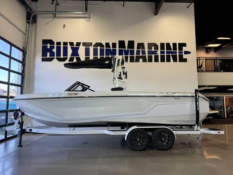 Slide: The Image of 2025 Nautique Super Air Nautique GS24 boat displayed at Buxton Marine showroom. - 4
