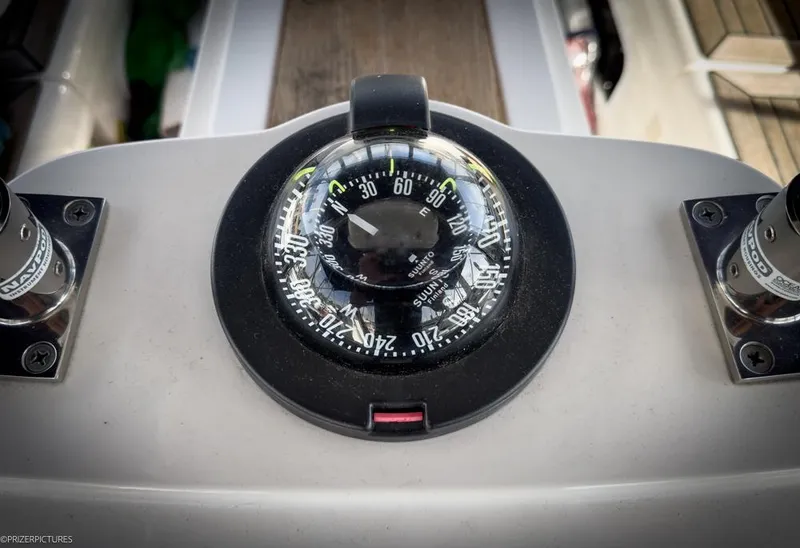 Slide: The Image of Compass on 2011 Elan Impression 384 yacht dashboard, displaying navigation directions. - 13