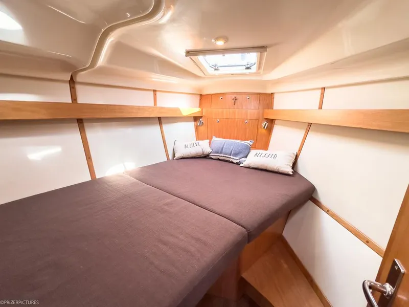 Slide: The Image of Cozy cabin interior of 2011 Elan Impression 384 yacht with comfortable bedding. - 14