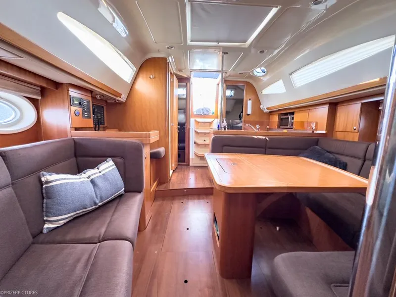 Slide: The Image of Interior of 2011 Elan Impression 384 yacht with wooden furnishings and cozy seating. - 21