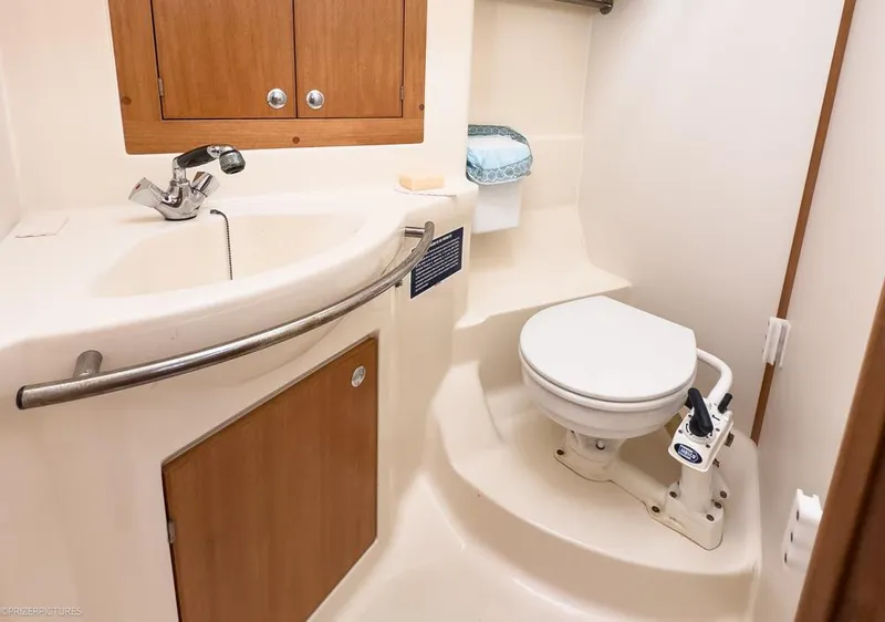 Slide: The Image of Compact bathroom in 2011 Elan Impression 384 yacht with sink and toilet. - 23