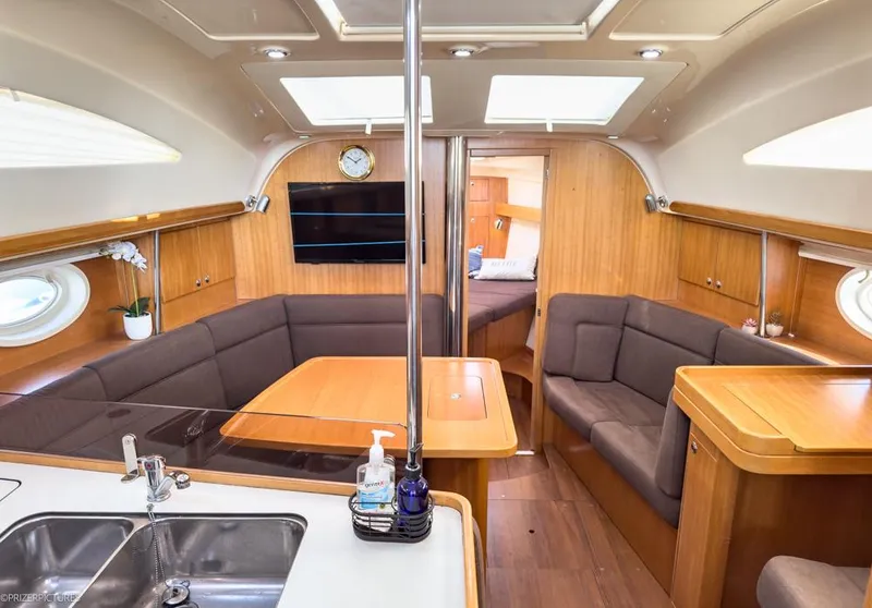 Slide: The Image of Interior of 2011 Elan Impression 384 yacht with modern seating and wooden finishes. - 27