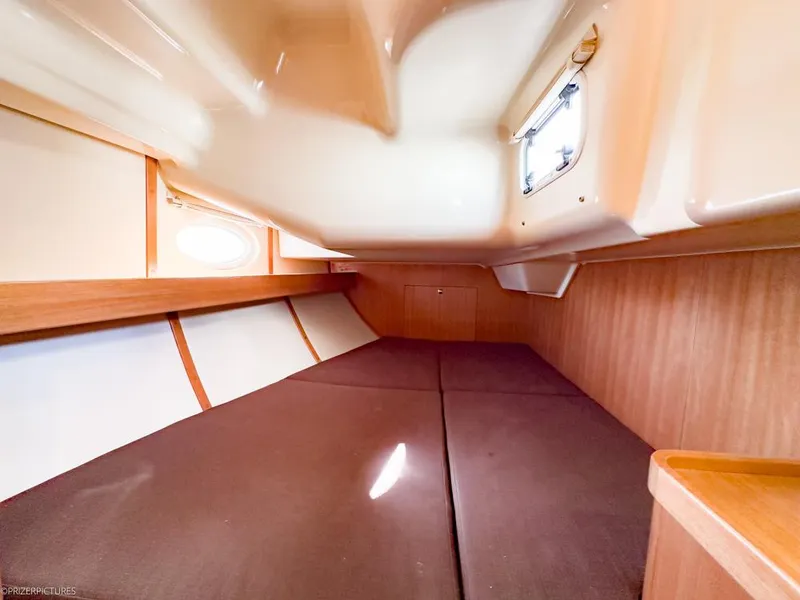 Slide: The Image of Interior cabin of 2011 Elan Impression 384 yacht, featuring cozy sleeping quarters. - 30