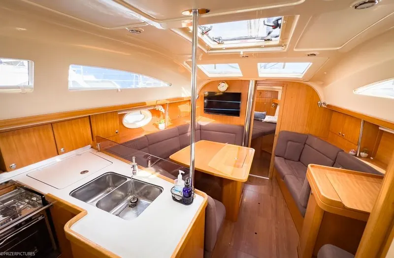 Slide: The Image of Interior of 2011 Elan Impression 384 yacht with modern kitchen and seating area. - 31