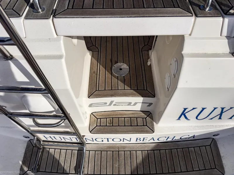 Slide: The Image of Elan Impression 384 yacht deck, 2011 model, Huntington Beach, CA, featuring teak wood finish. - 4