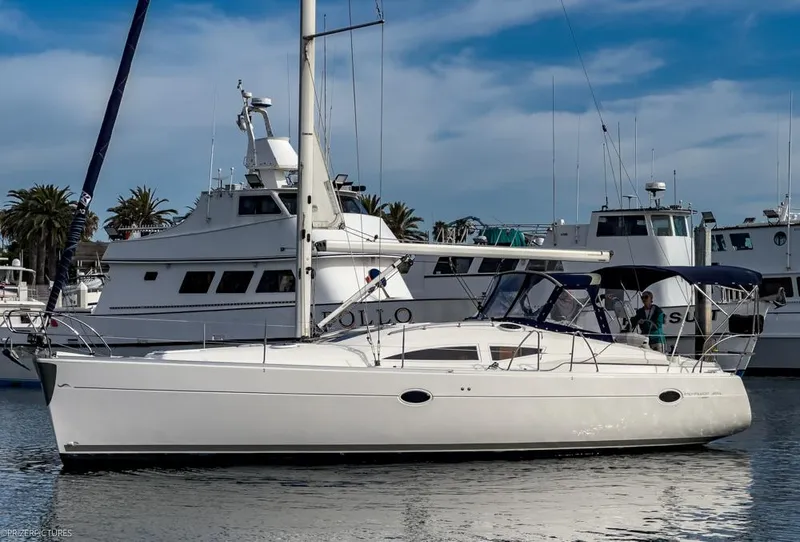 Slide: The Image of 2011 Elan Impression 384 sailboat docked in a marina with other boats. - 5