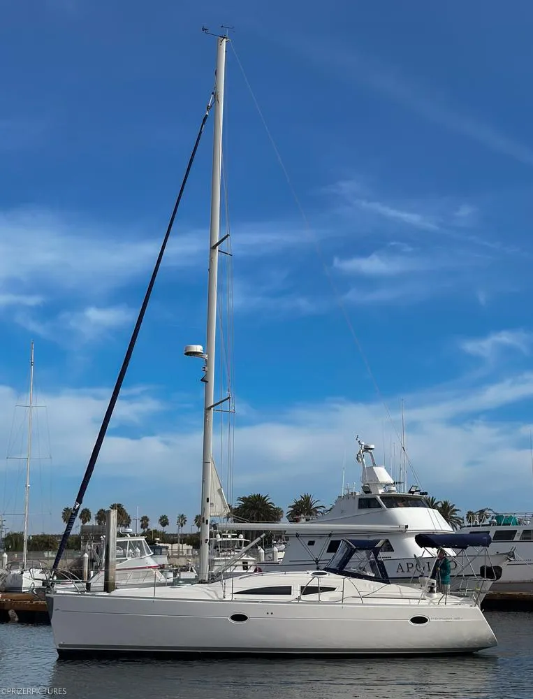 Slide: The Image of 2011 Elan Impression 384 sailboat docked under a clear blue sky. - 6