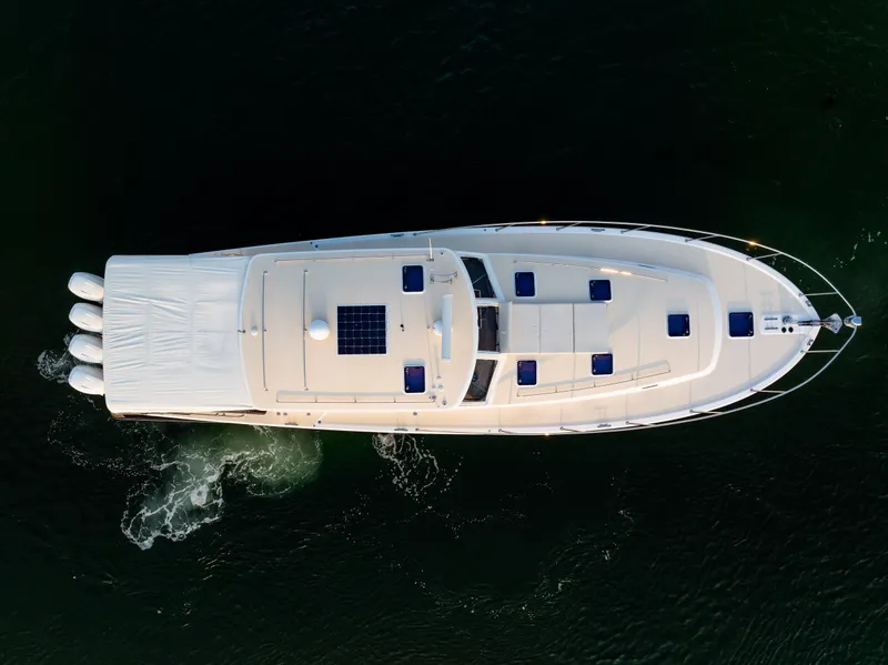 Slide: The Image of Aerial view of 2020 MJM 53z yacht cruising on dark water. - 10