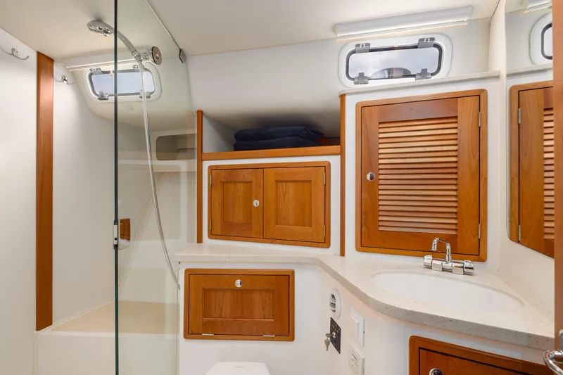 Slide: The Image of Luxurious bathroom in 2020 MJM 53z yacht with wooden cabinets and modern fixtures. - 11