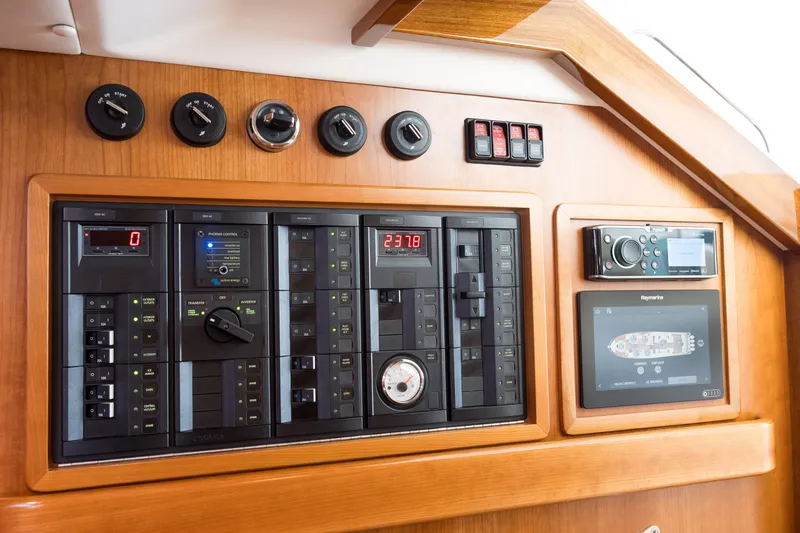 Slide: The Image of Control panel of 2020 MJM 53z yacht with gauges, switches, and navigation display. - 12
