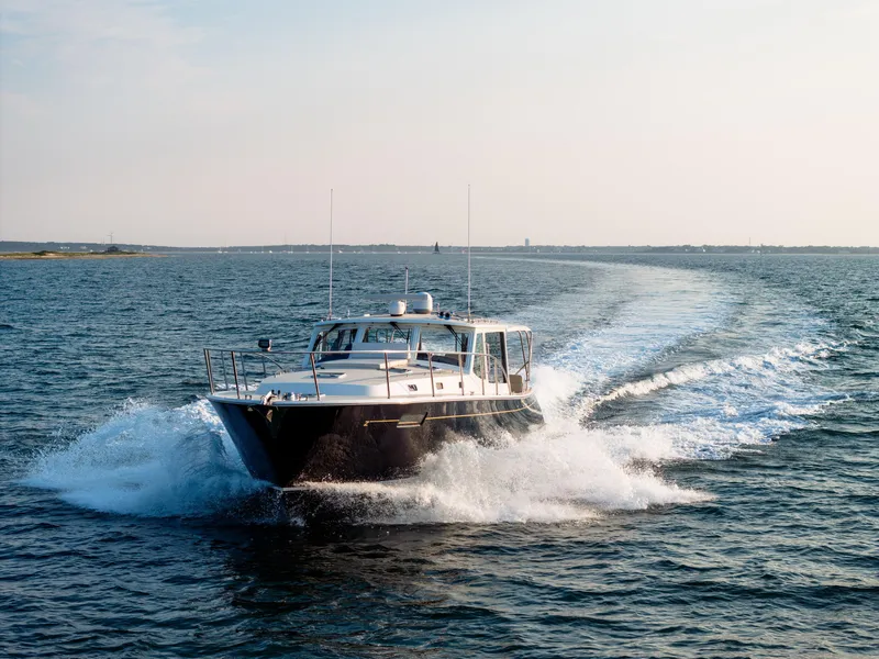 Slide: The Image of MJM 53z 2020 yacht cruising on open water, creating a dynamic wake. - 9