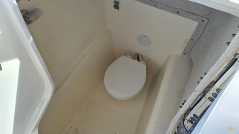 Slide: The Image of 2009 World Cat 250 DC boat interior with compact marine toilet. - 14