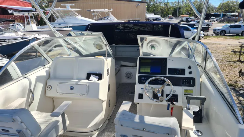 Slide: The Image of 2009 World Cat 250 DC boat interior with dual consoles and navigation equipment. - 15