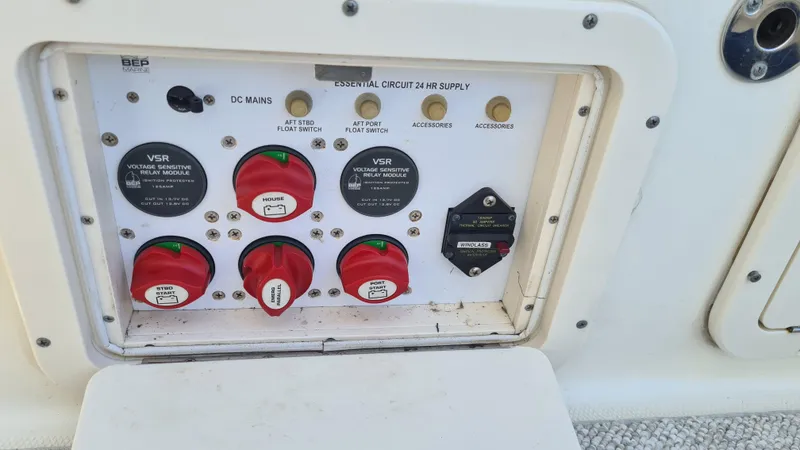 Slide: The Image of Control panel of a 2009 World Cat 250 DC boat with switches and dials. - 17