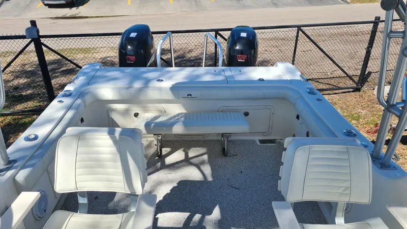 Slide: The Image of 2009 World Cat 250 DC boat interior with seating and dual outboard motors. - 18