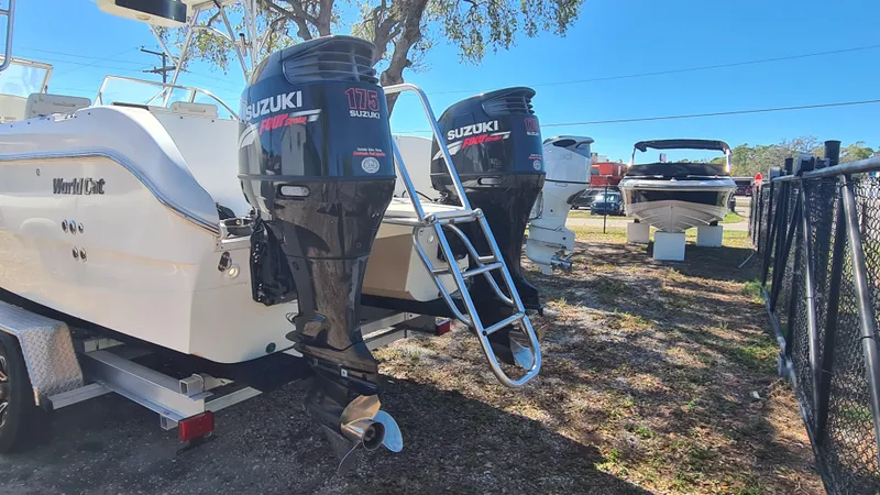 Slide: The Image of 2009 World Cat 250 DC boat with dual Suzuki outboard motors on display. - 22