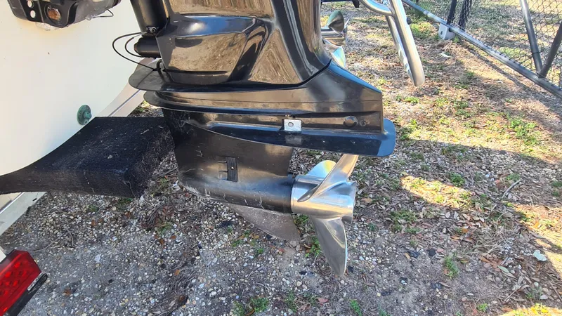 Slide: The Image of Outboard motor of a 2009 World Cat 250 DC boat on a trailer. - 25