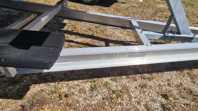 Slide: The Image of Boat trailer for 2009 World Cat 250 DC on gravel surface. - 26