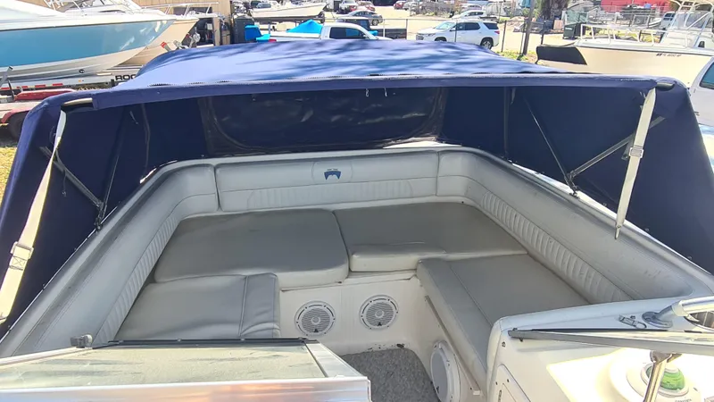 Slide: The Image of 2009 World Cat 250 DC boat interior with cushioned seating and canopy. - 6