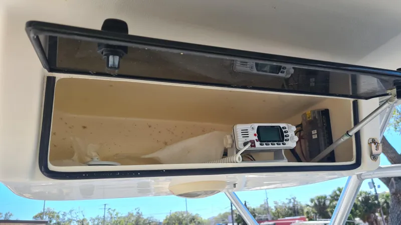 Slide: The Image of 2009 World Cat 250 DC boat storage compartment with radio equipment. - 9