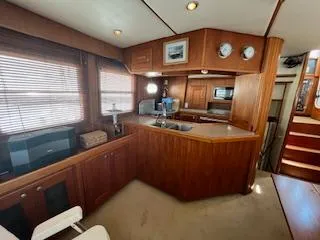 Slide: The Image of Interior of 2001 Nordhavn 40 yacht with wooden cabinetry and modern kitchen amenities. - 25