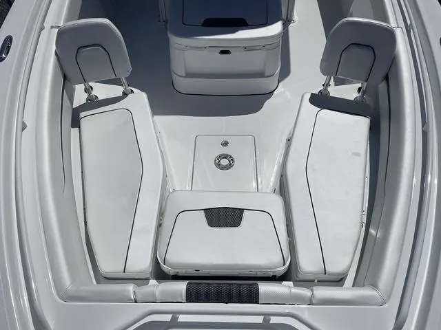 Slide: The Image of 2023 Wellcraft 352 Fisherman boat interior with white cushioned seating and storage compartments. - 25