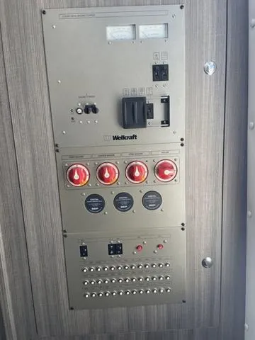 Slide: The Image of Control panel of 2023 Wellcraft 352 Fisherman boat with switches and dials. - 33