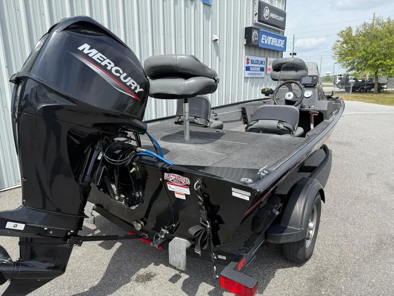 Slide: The Image of 2020 Bass Tracker Classic XL boat with Mercury engine, parked outdoors. - 10