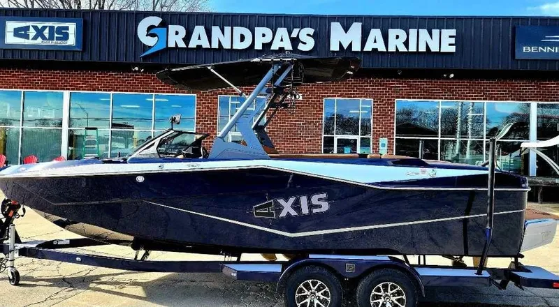 Slide: The Image of 2024 Axis Core Series T235 boat at Grandpa's Marine dealership. - 1