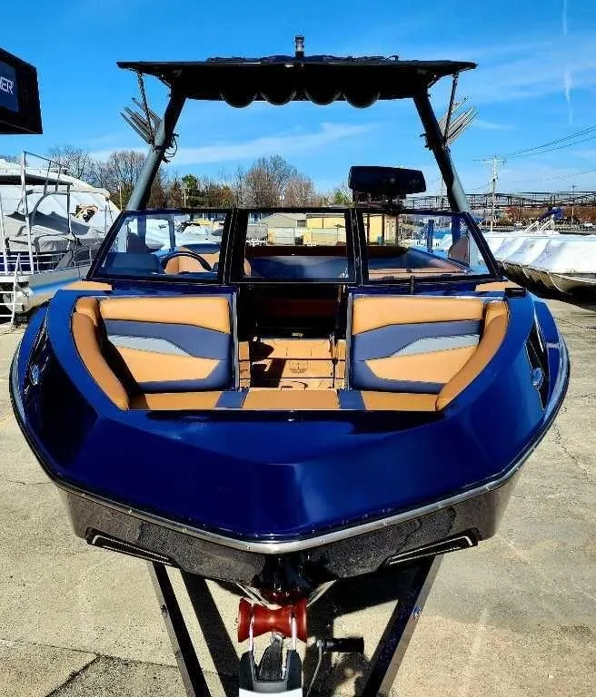 Slide: The Image of 2024 Axis Core Series T235 boat with sleek design and spacious seating. - 5