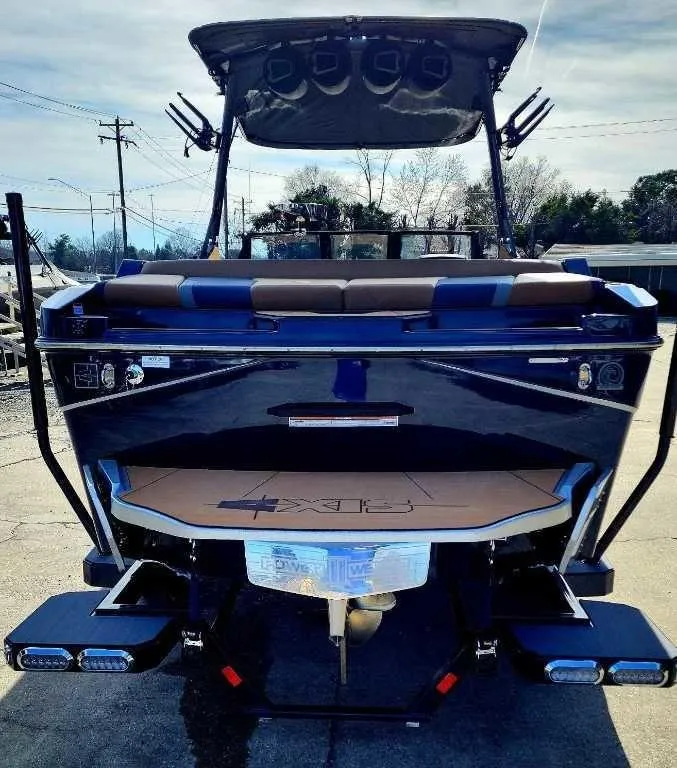 Slide: The Image of 2024 Axis Core Series T235 boat, rear view, showcasing sleek design and modern features. - 8