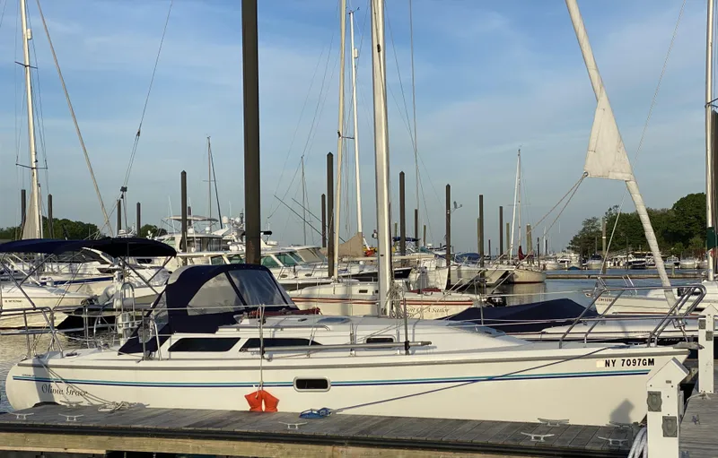 Slide: The Image of Sailboat Catalina 28 MkII 1997 docked at marina with clear sky background. - 0